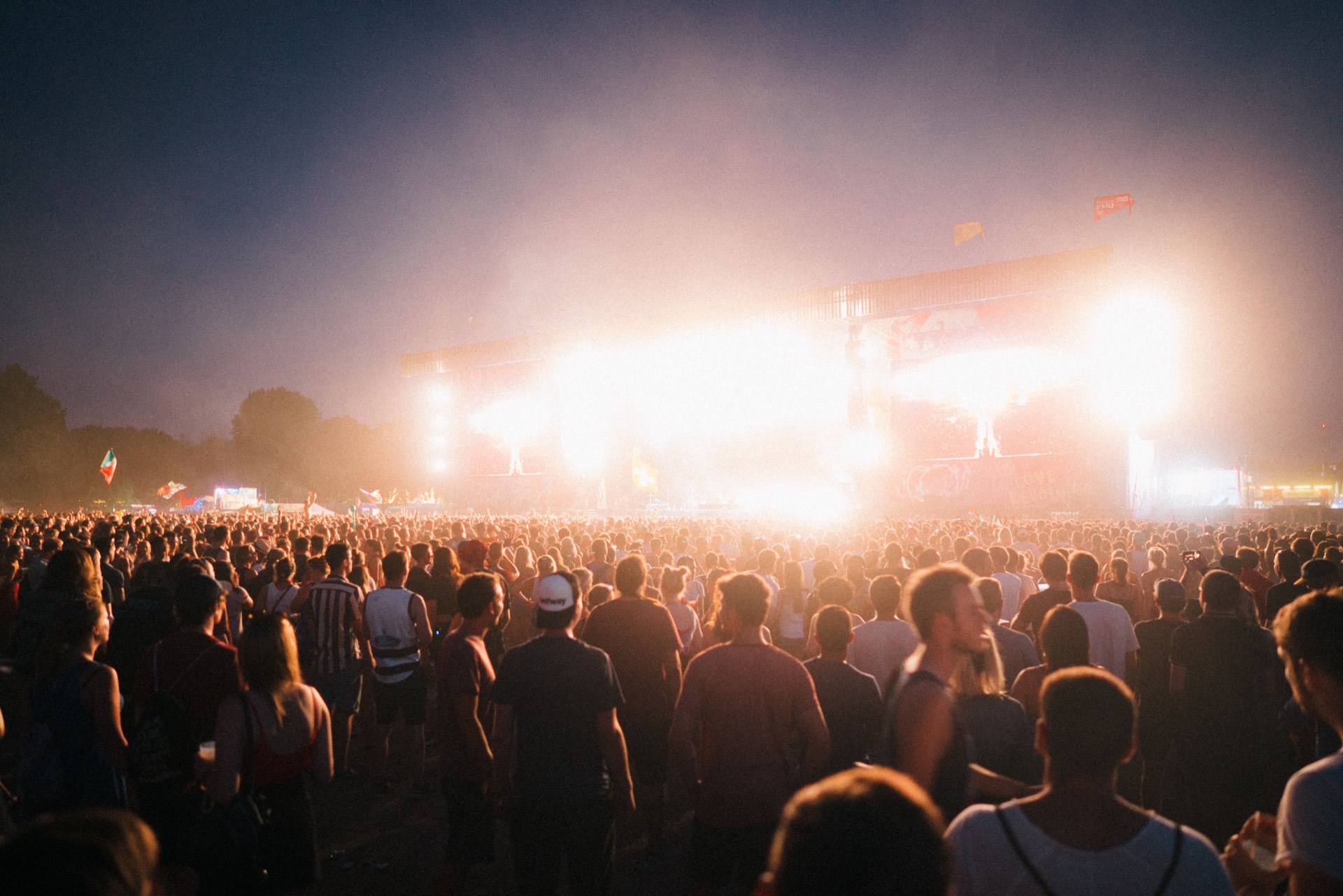 A huge music-festival crowd under open sky